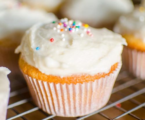 The easiest homemade cupcakes in the world with simple vanilla frosting. | livinglou.com