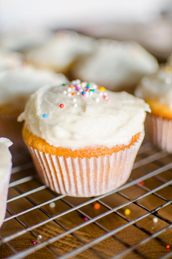 The easiest homemade cupcakes in the world with simple vanilla frosting. | livinglou.com