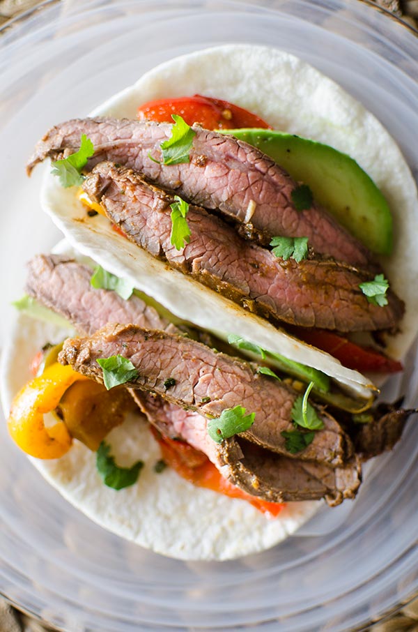 Flank steak fajitas with avocado and bell peppers. livinglou.com