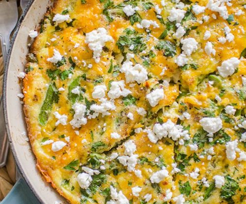 Bacon and asparagus frittata topped with feta.