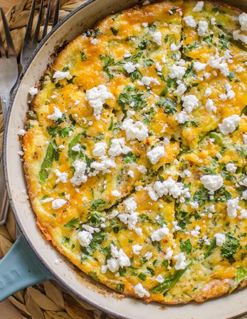Bacon and asparagus frittata topped with feta.