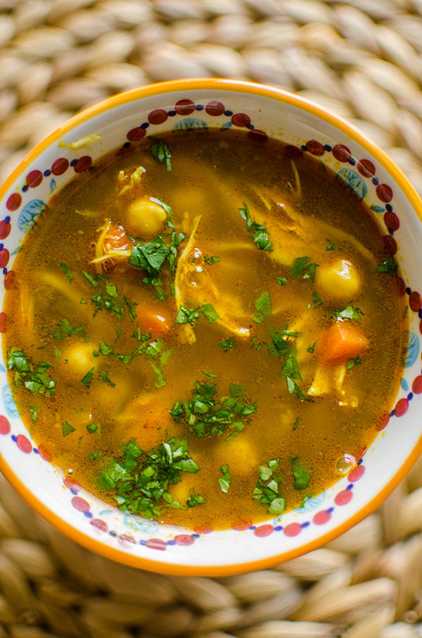 Moroccan chicken soup in a colourful bowl.