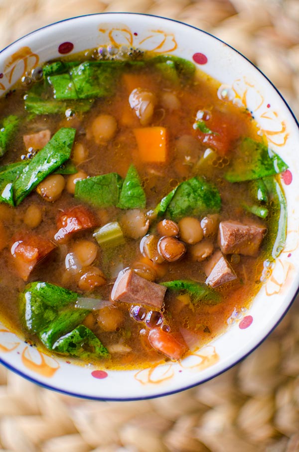 Slow cooker lentil and ham soup in a bowl.