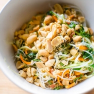 Vermicelli noodle salad in a bowl topped with salted peanuts