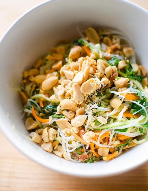 Vermicelli noodle salad in a bowl topped with salted peanuts