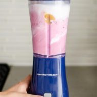 Triple berry smoothie in the blender being blended.