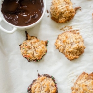 Cinnamon macaroons with a pot of melted chocolate.