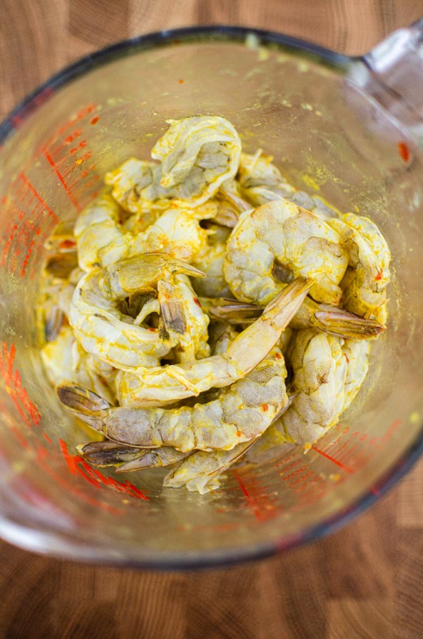 Shrimp marinating in lime juice, chili flakes coriander, turmeric and garlic.