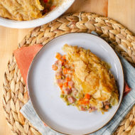 A slice of ham pot pie on a plate