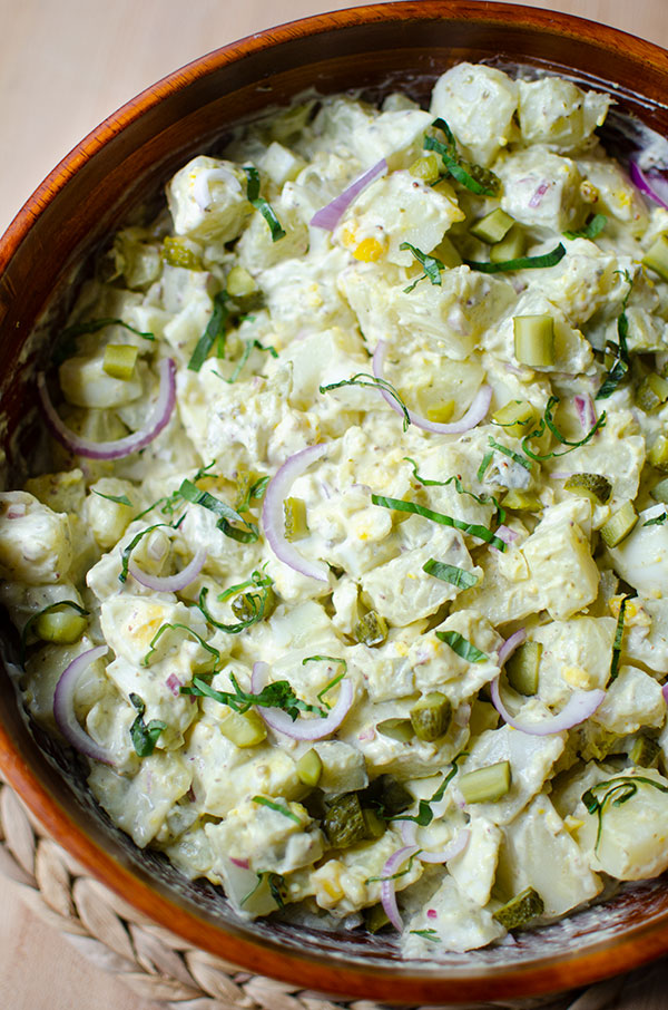 Potato salad in a wooden bowl