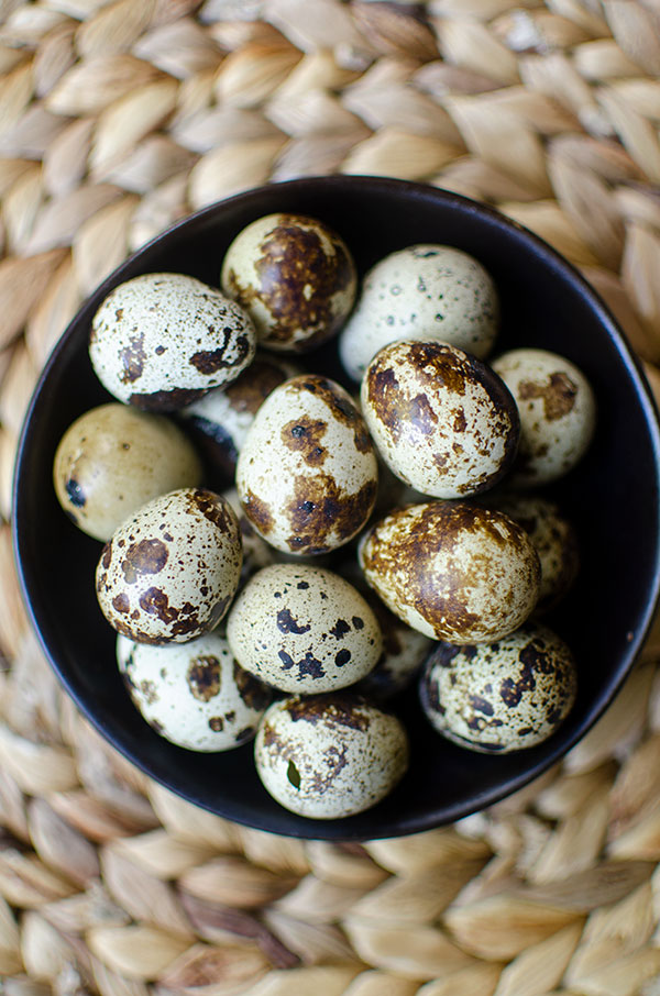 quail eggs in a black bowl
