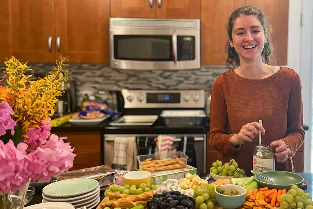 photo of Louisa building a cheeseboard