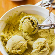 Matcha ice cream scoops in a bowl