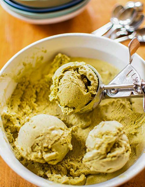 Matcha ice cream scoops in a bowl