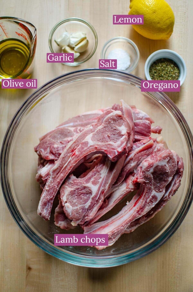 Ingredients for lamb chops including olive oil, garlic, salt, oregano and lemon