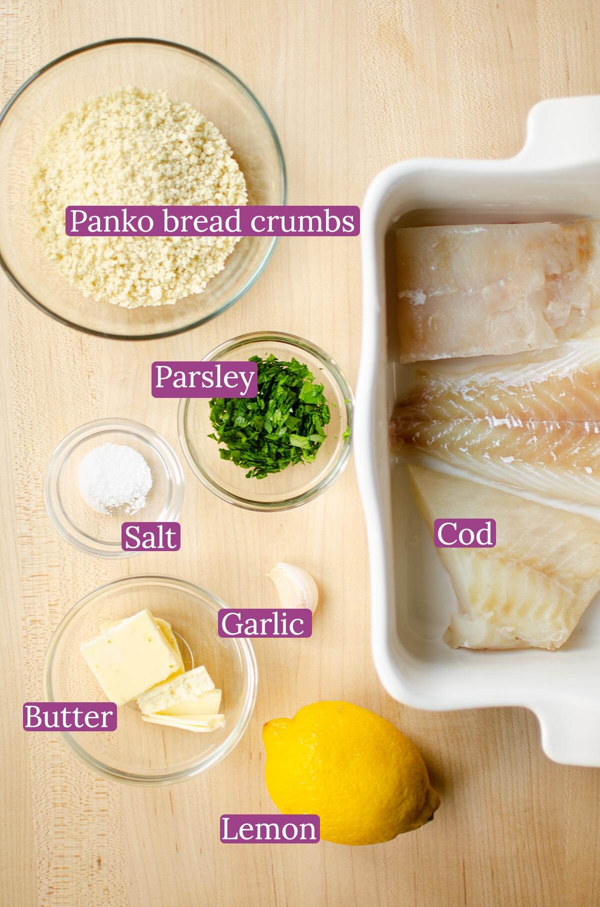 Ingredients in glass bowls on a wooden cutting board.