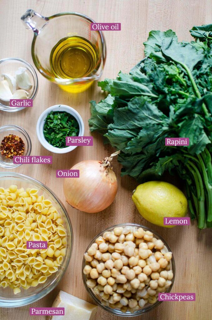 Ingredients for the pasta on a wooden board.