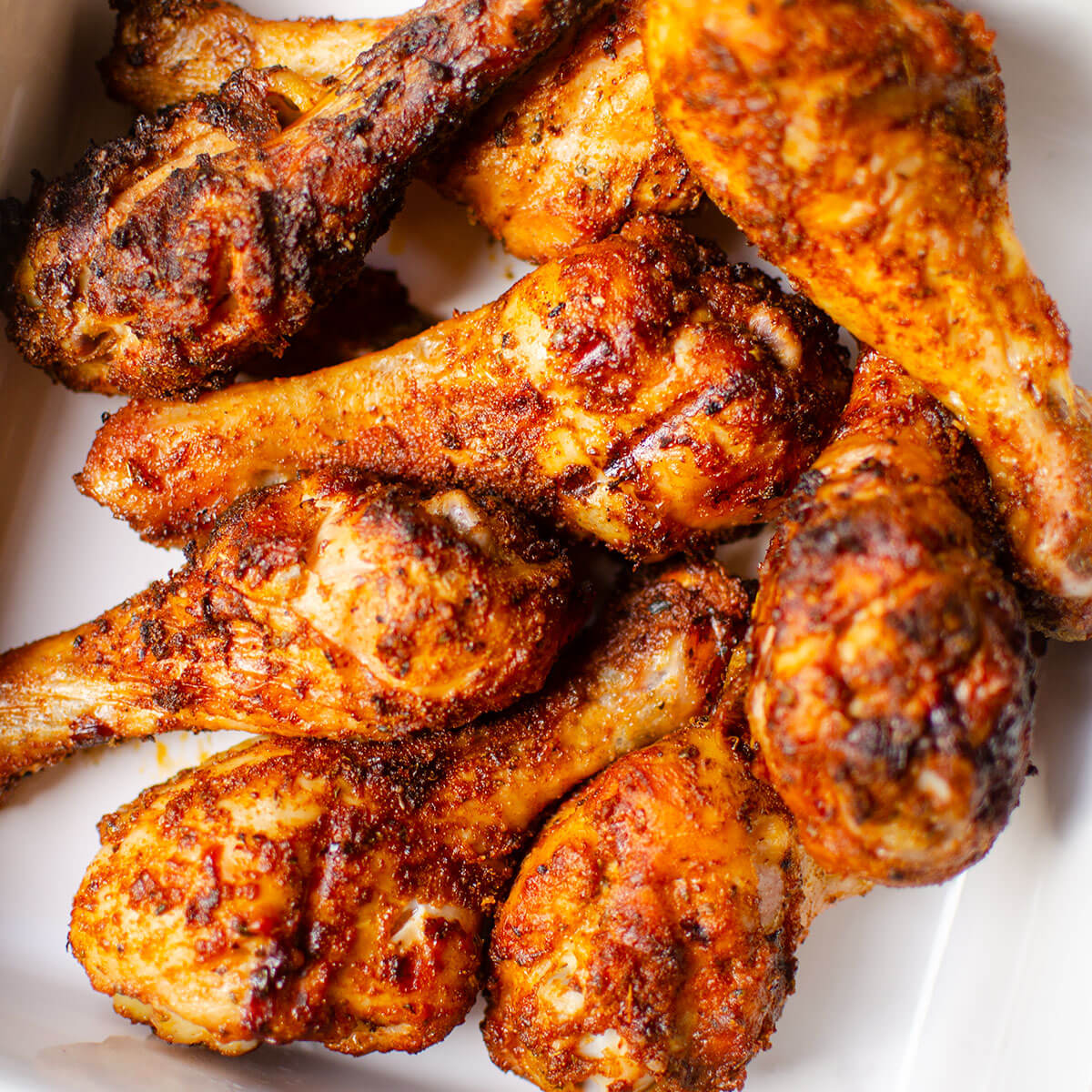 Closeup of chicken in a white dish.